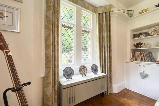 Built-in shelving and storage by one of the property's attractive windows