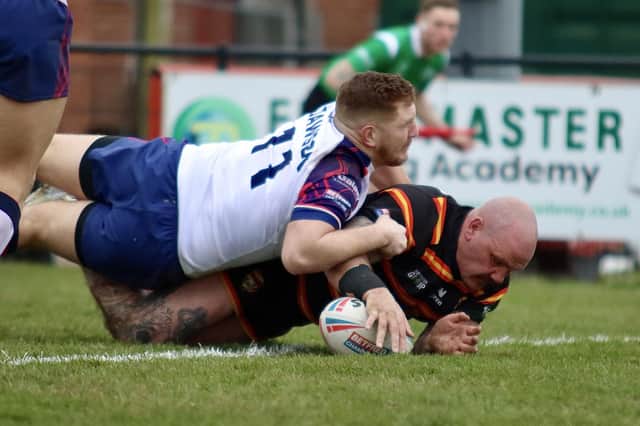 Dale Ferguson gets the ball down over the line for a try for Dewsbury Rams against Midlands Hurricanes.