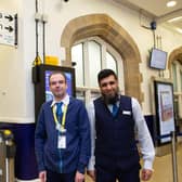 Relieved and happy staff at Dewsbury Train Station after it was announced that plans to close ticket offices around England had been scrapped. Pictured are customer support supervisors Chris Blackburn and Ilyas Hans.