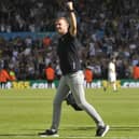 Jesse Marsch salutes the fans after Leeds United's big win against Chelsea.