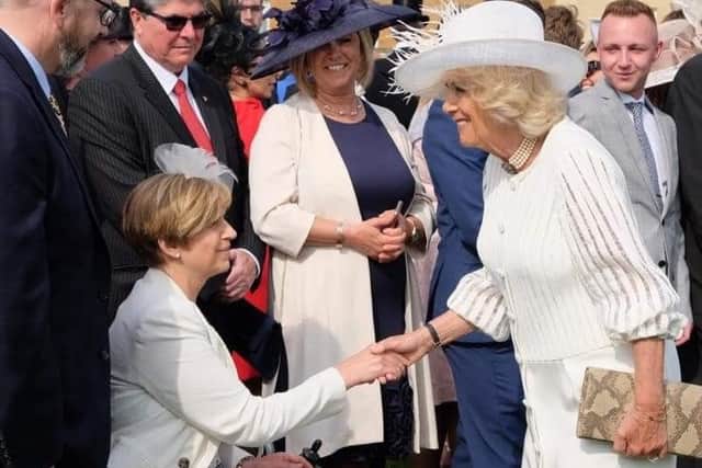 Oakenshaw Residents Association Social Group volunteer Emma Ferdinand, meeting Camilla, the Queen Consort, in 2019 at a Royal Garden Party at Buckingham Palace.