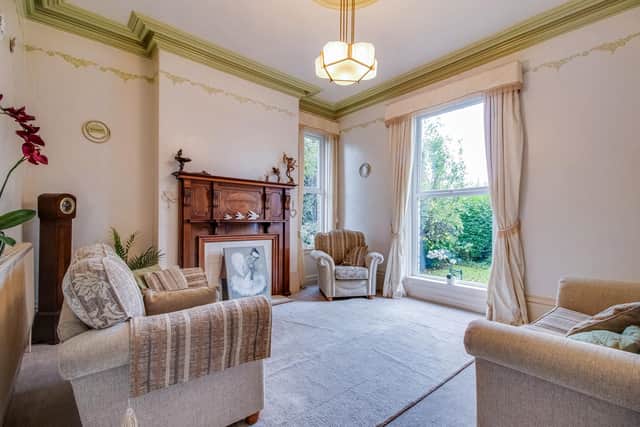 There's a stunning feature fireplace in the lounge that is brightly lit by large sash windows.
