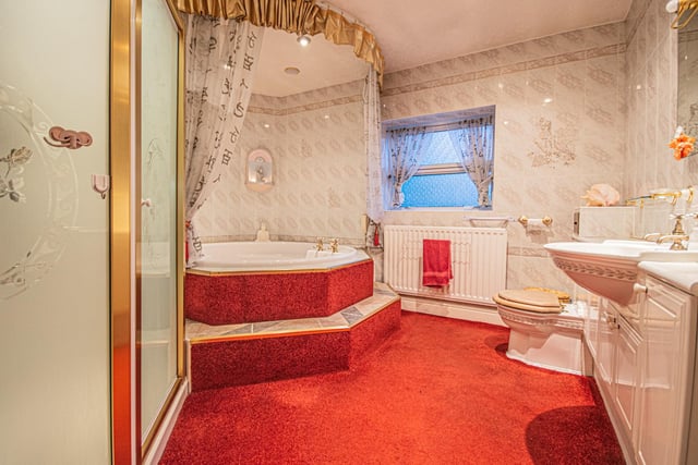 A luxury bathroom with jacuzzi style bath.