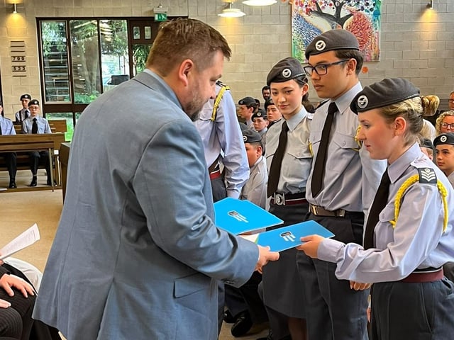 Mr Paul Brook presents BTEC Diplomas to Sgt Harvie Kenny-Greenwood, FS Gabriella Green, Sgt Neo Graham and FS Lily Dillon.