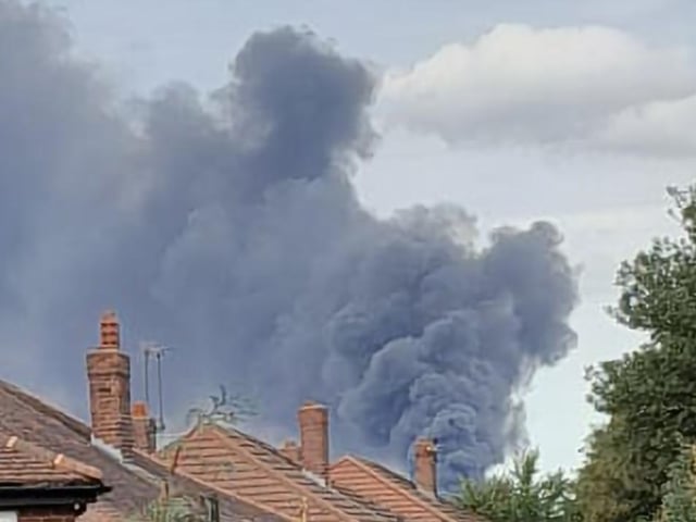 The view of the blaze from Scholes.