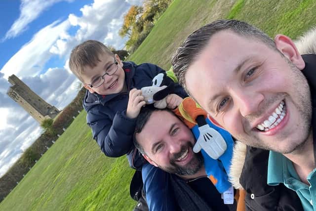 Ant Devine with husband Dean and their three-year-old son.