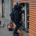 Officers carrying out a warrant at a premises in Ravensthorpe as part of the 'Clear, Hold, Build' programme.