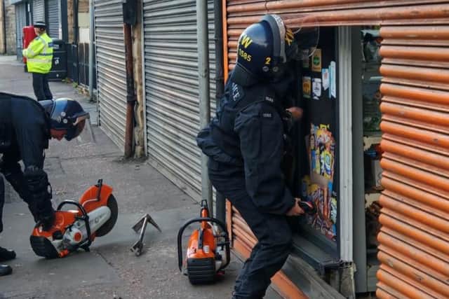 Officers carrying out a warrant at a premises in Ravensthorpe as part of the 'Clear, Hold, Build' programme.