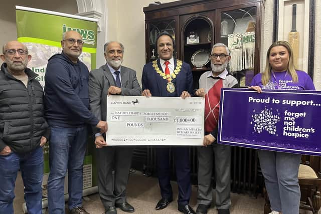 The cheque of £1,000 was presented to Mayor Masood Ahmed and Alex Chanteleau from Forget Me Not Children’s Hospice.