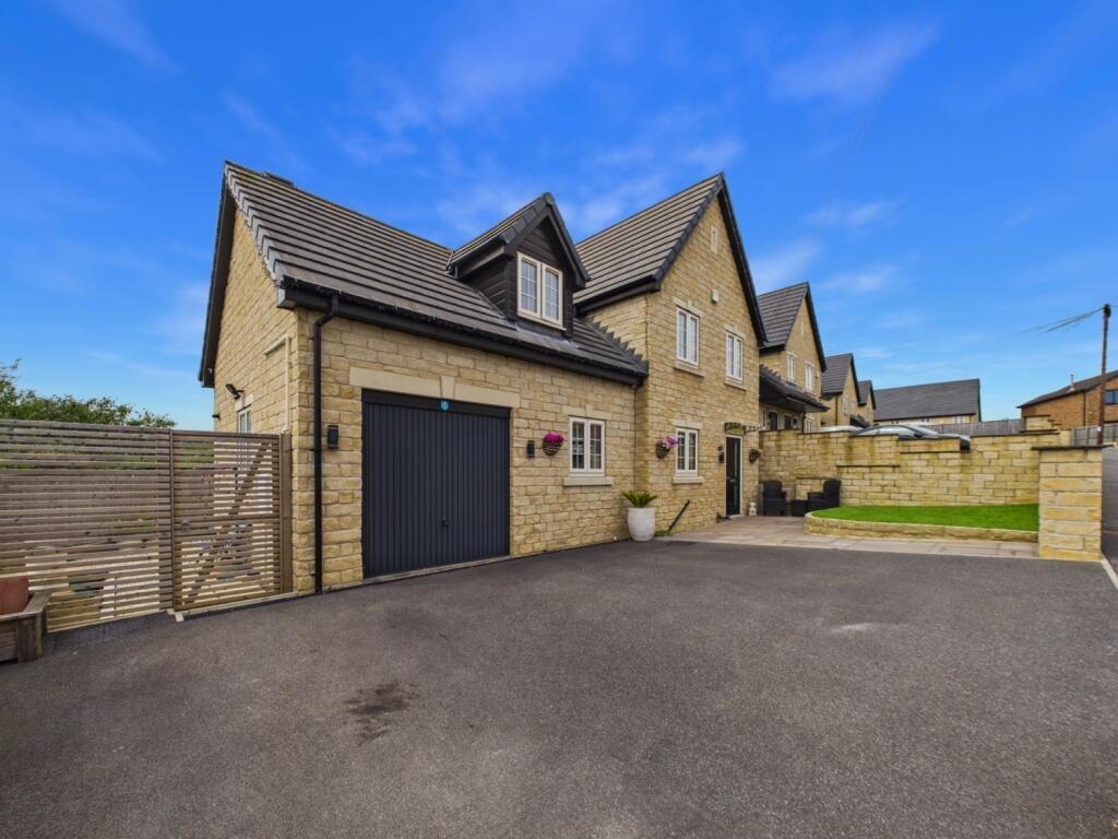 This property, on Moat Hill Farm Drive in Birstall, is on sale with EweMove for offers over £425,000.