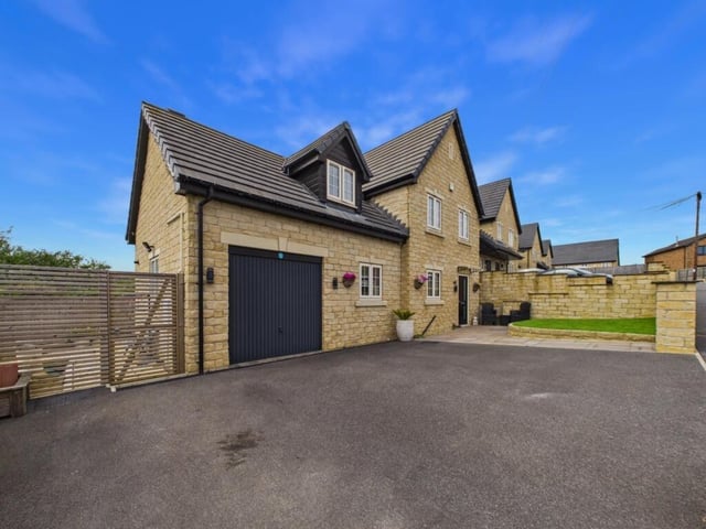 This property, on Moat Hill Farm Drive in Birstall, is on sale with EweMove for offers over £425,000.