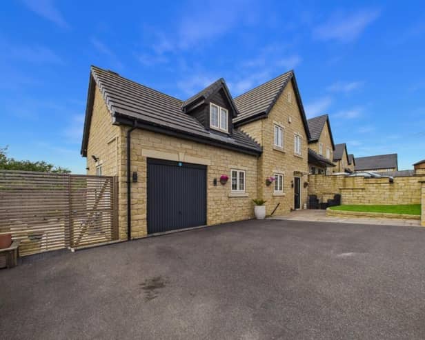 This property, on Moat Hill Farm Drive in Birstall, is on sale with EweMove for offers over £425,000.