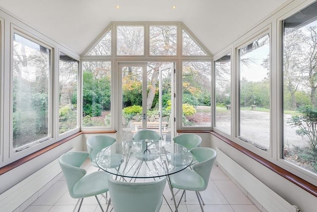 A versatile conservatory space with French doors leading outside.
