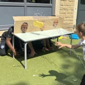 'Splat the teacher' was one of the popular attractions at the school's summer fair