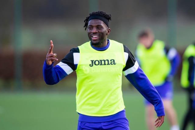 Rocky Bushiri gestures during training as the Belgian defender is all smiles ahead of the Ross County clash