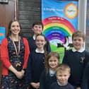 Lesley Evans, headteacher at St Peter’s C of E (VA) Junior, Infant and Early Years School in Birstall, celebrates the school's latest Ofsted report with pupils.
