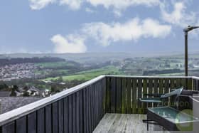 A decked seating area to the rear of the house offers exceptional, far reaching views.