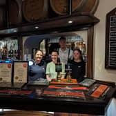 Lina James, front middle, with staff at the Black Bull in Liversedge having claimed the Campaign For Real Ale’s (CAMRA) Pub of the Year 2024 in the Heavy Woollen district award.