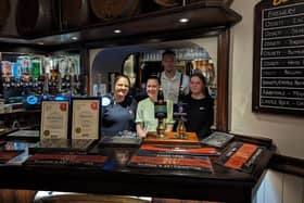 Lina James, front middle, with staff at the Black Bull in Liversedge having claimed the Campaign For Real Ale’s (CAMRA) Pub of the Year 2024 in the Heavy Woollen district award.