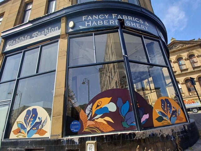 Floral coloured designs with stitch details on a shop front in Northgate.