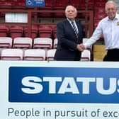 Peter McVeigh, chairman and managing director of Status International (UK) Ltd, with Batley Bulldogs' chairman Kevin Nicholas after signing up as a major sponsor of the club.