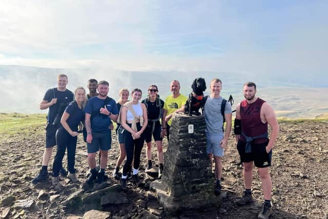 Chris Matthews, second from the right, and his group at the summit of Pen-y-ghent during their Three Peak challenge