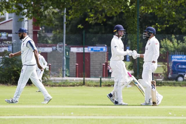 Cleckheaton batsmen Lachlan Doidge (left) and Waleed Akhtar chat during their 158-run opening stand against Batley. (Photo by Jim Fitton)