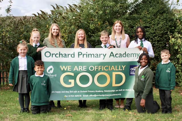 Staff and pupils at Orchard Primary Academy in Chickenley celebrate the school's 'good' Ofsted report