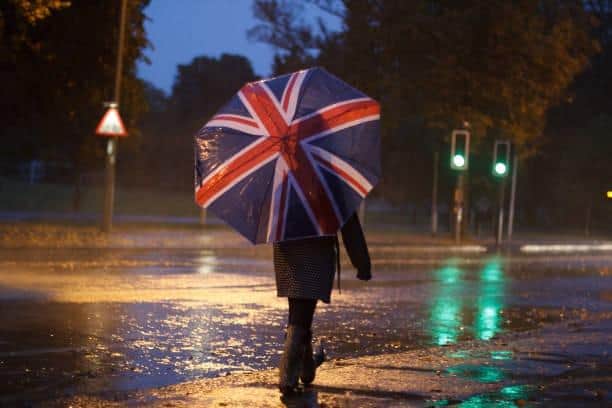 Brolly good show: The Met Office has announced 'poor weather' throughout the UK across the coronation bank holiday weekend.