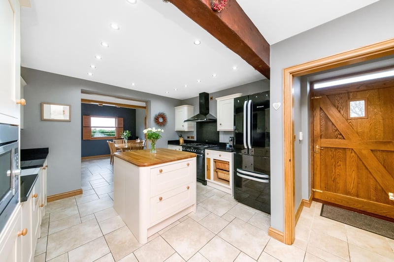 The open plan breakfast kitchen has fitted units with oak and granite worktops, and a rangemaster cooker with warming ovens.