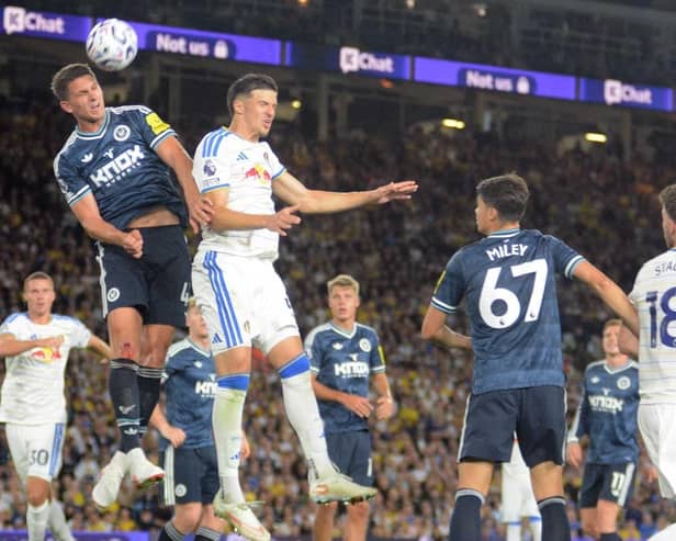 Leeds United defender Tarik Muharemovic challenges for a high ball.