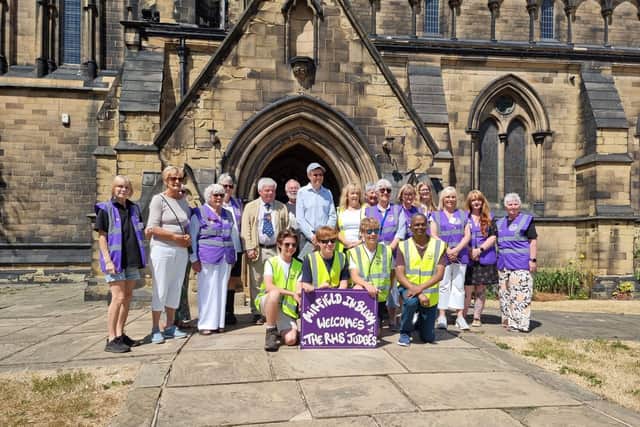 Mirfield in Bloom volunteers outside St Mary's Church.