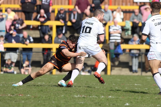21. Reiss Butterworth tackles 2021 Challenge Cup winner Kyle Amor in Dewsbury Rams' superb 32-12 victory over Widnes Vikings in the fourth round on Sunday, April 2, 2023. (Photo credit: Thomas Fynn)