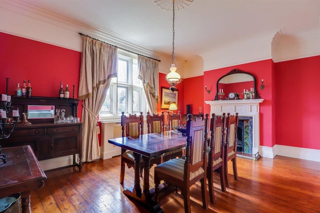 The formal dining room is another impressive room, with a bespoke, original fireplace.