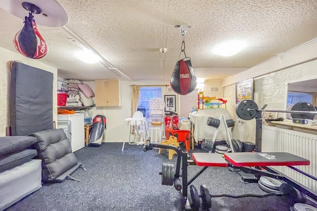This room is currently used as a home gym, but could be a bedroom, games room or other.