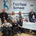 Fairfield School in Batley has received a £15,000 donation from St John’s Masonic Lodge in Dewsbury. Pictured are Sarah Breeze, fundraiser at Fairfield, John Page, headteacher at Fairfield, Steve Walsh, school business manager, Sue France and Karen Kirk, and John Hudson, charity steward of St John’s Masonic Lodge Dewsbury, as well as pupils from Fairfield.
