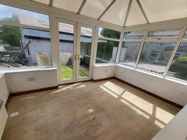 This conservatory could be replaced by a gabled extension, within plans that have been approved.