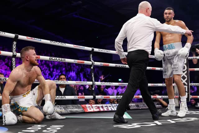 Callum Simpson knocks Steed Woodall down in his first British super middleweight title defence. Picture: Lawrence Lustig/Boxxer