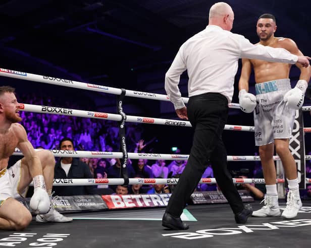 Callum Simpson knocks Steed Woodall down in his first British super middleweight title defence. Picture: Lawrence Lustig/Boxxer