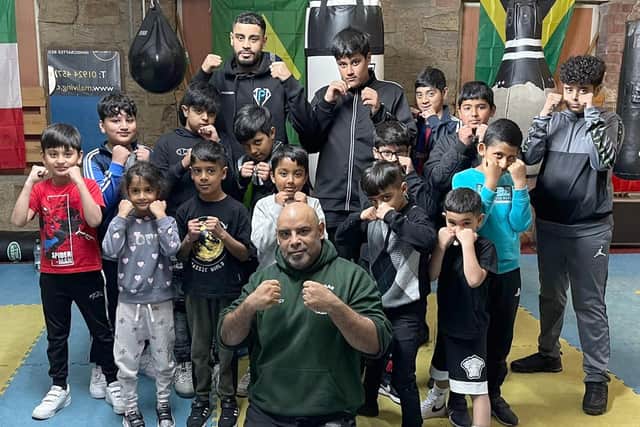 Manager Zahir Akbar (front) with some of the Mohammadiya Ghausia Jamia Mosque pupils at the Warrior Breed Gym in Dewsbury