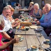 Members of Brighouse and Huddersfield enjoying a sunny lunch in Uppermill recently