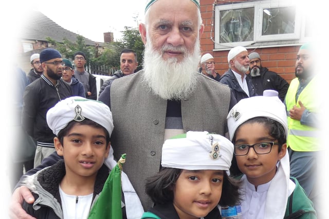 Children with their grandparents at the peace procession in Heckmondwike
