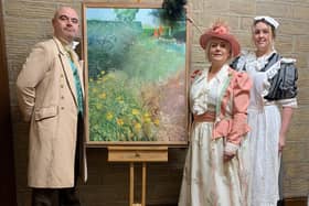 The cast of 'Ah Ah!' with a painting by David Wood. From left to right, Simon Beaumont, Alison Hartley and Stacey Fleming.
