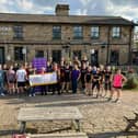 The Dewsbury Road Runners present a cheque to PSPA