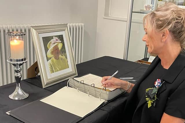 Cathryn Riley signing the book of condolence at Dewsbury Town Hall.
