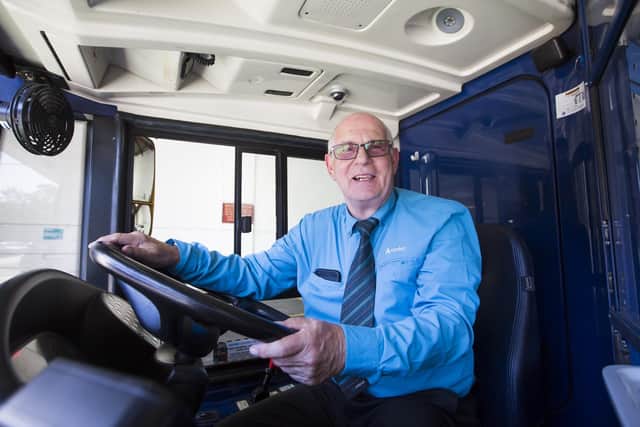 Bus driver Tony Dickens who has been driving buses for 55 years, behind the wheel at the Arriva bus depot in Heckmondwike.