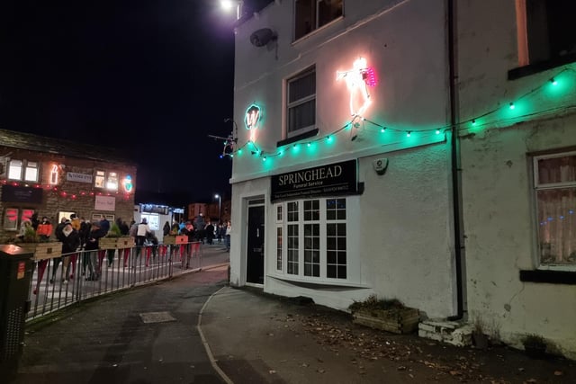 Businesses throughout the village have been lit up.