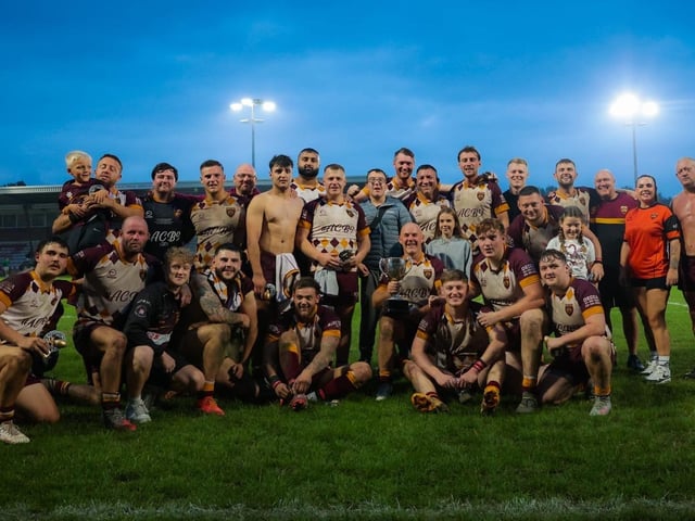 Dewsbury Moor Maroons' A team celebrate winning the John Kane Trophy final.