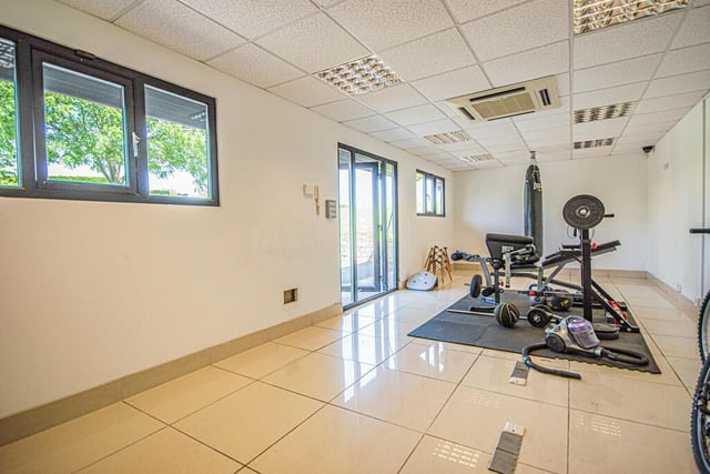 The adaptable annexe is currently used as a gymnasium, with its own w.c..