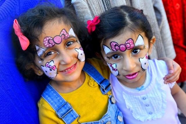Laaibah Mobeen and Zainab Zaheer with their faces painted.